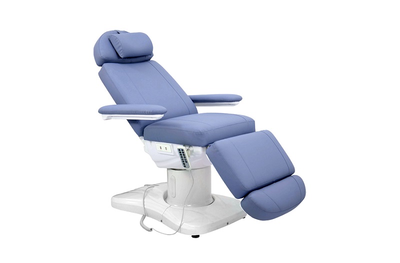 Blue electric facial bed with motorized height and angle control, designed for modern beauty salons