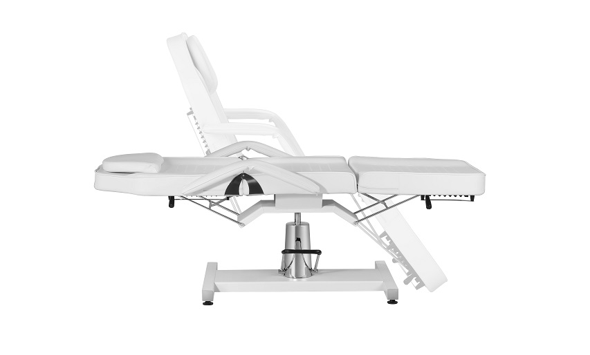 White hydraulic beauty bed with adjustable backrest, seat, and leg section for salon use